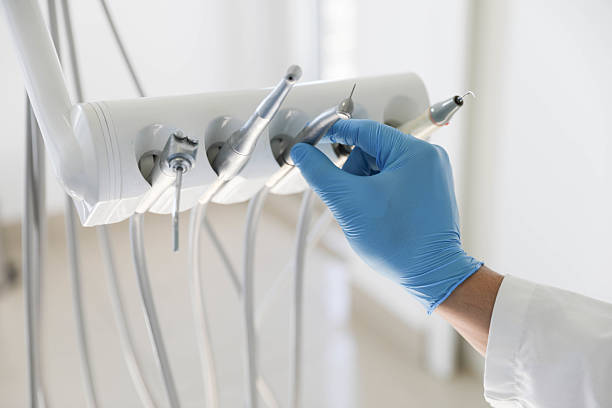 Professional Tooth Extraction technician working in Limestone Creek, FL